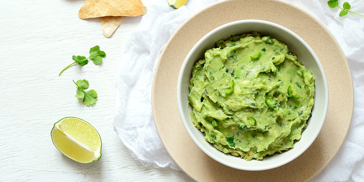 Guacamole freshly cooked and served in a bowl, overhead view