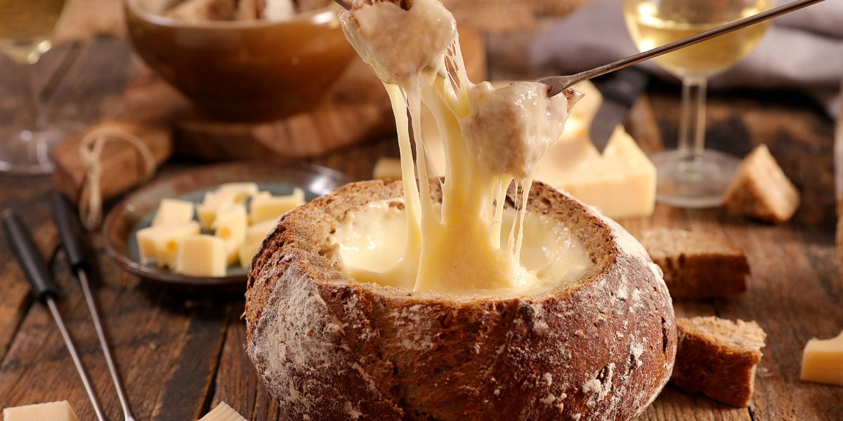 cheese fondue bread bowl with wine and bread