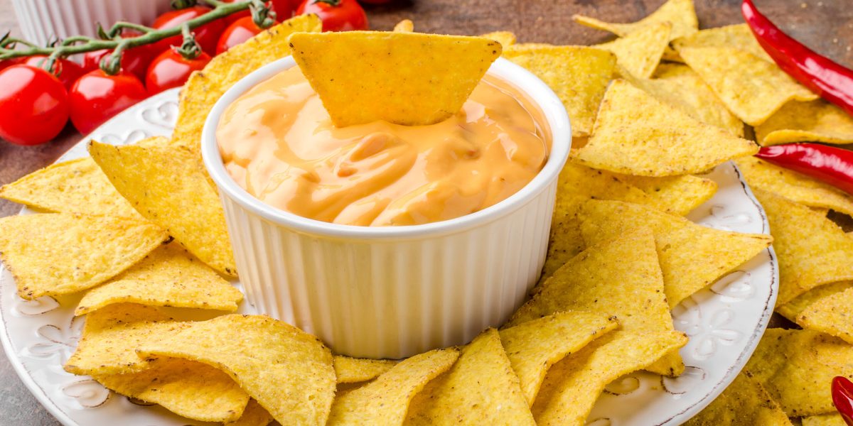 Tortilla chips with two dips, chilli hot and cheese dip