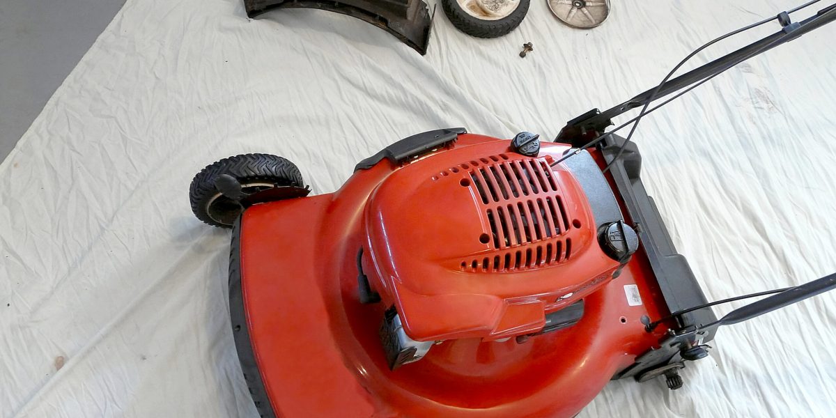 A lawnmower has been partially disassembled for servicing prior to the mowing season.