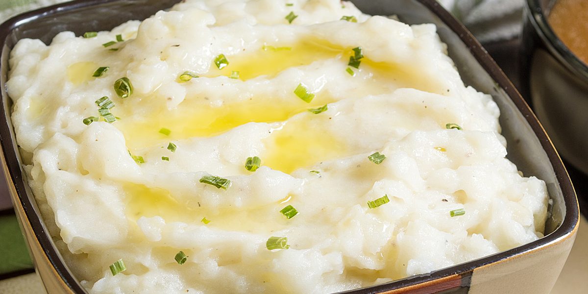 mashed potatoes with melted butter and chives along with gravy on the side "mashed potatoes"