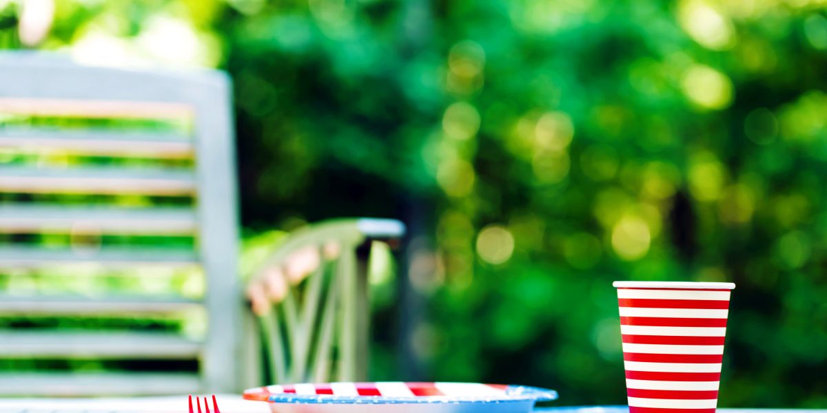 Fourth of July party table setting with plate and cup outside